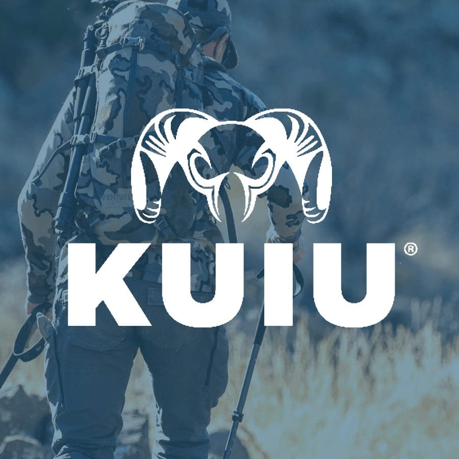 KUIU hunting gear: Hunter with backpack in camouflage.